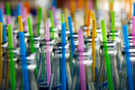 straw in glass bottleの写真素材