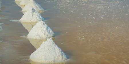 Salt field ready to be farmed in salt farm at Ban Laem-Thailandの写真素材
