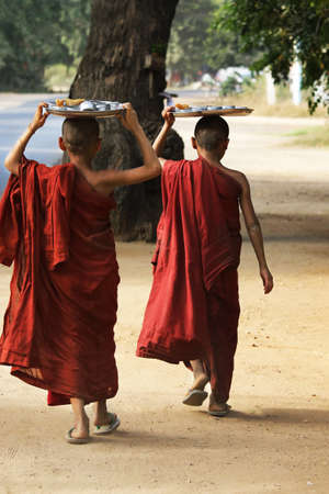 Novice Monks Received in the Historical Park of Bagan, Myanmarの写真素材