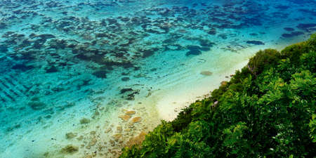 view of the coast and coral at bukit in bali -indonesiaの写真素材