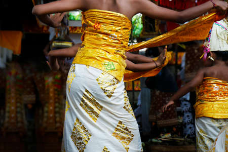 Balinese woman dancing during Bali-Indonesia ceremony