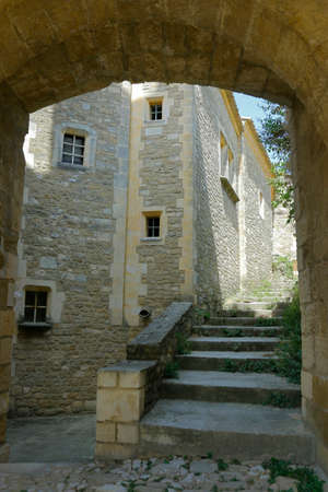 facade of mediterranean building with stone wall