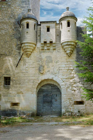 facade of mediterranean castle with stone wallの写真素材