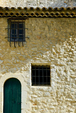 facade of mediterranean building with stone wallの写真素材