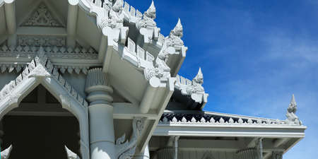 white buddhist temple with statue of buddha