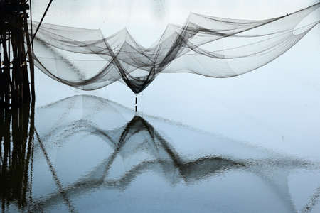 reflection of fisherman net in phattalung thailandの写真素材