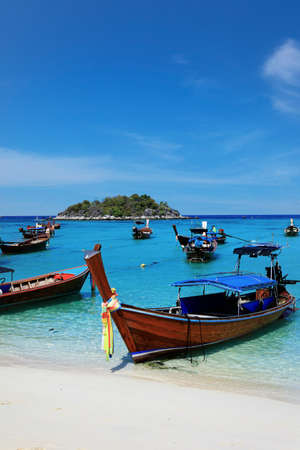 long tail boat, in white sand beach in the andaman seaの写真素材