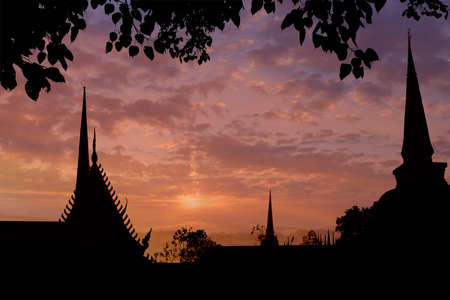 silhouette of buddhist temple at sunset timeの写真素材