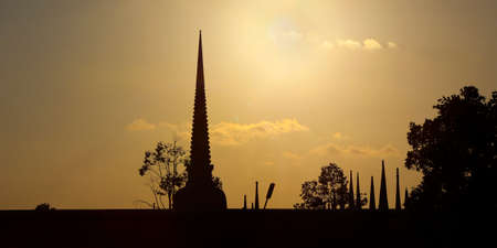 silhouette of buddhist temple at sunset timeの写真素材