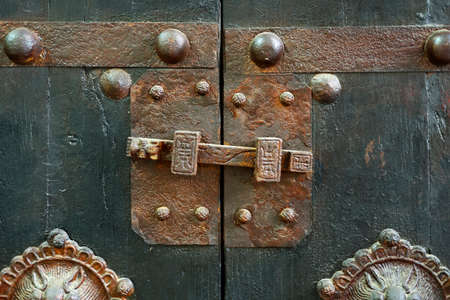 antique wooden closet with brass handleの写真素材