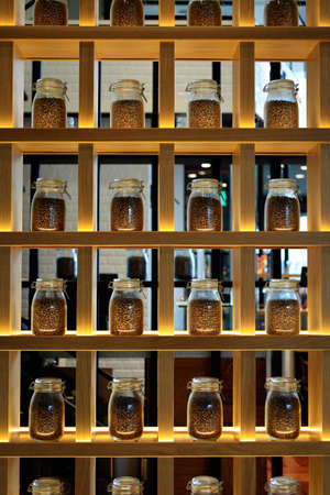 SHELVES FILLED WITH COFFEE BEANS POTSの写真素材