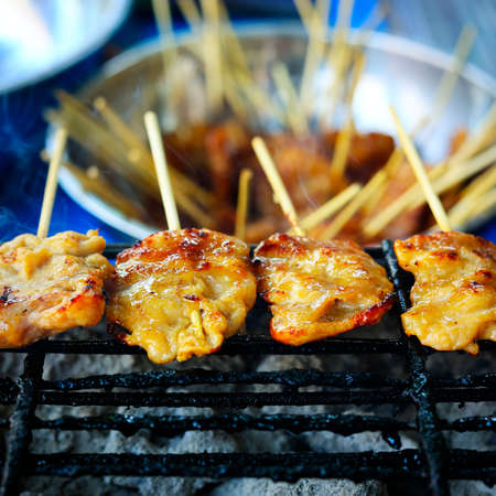 skewer of sweet pork cook on thai barbecueの写真素材