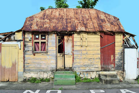 Very typical wooden house with green stairs at Roseau, the capital of Dominica in the Caribbeanの写真素材