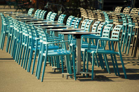Chairs and tables in a rowの写真素材