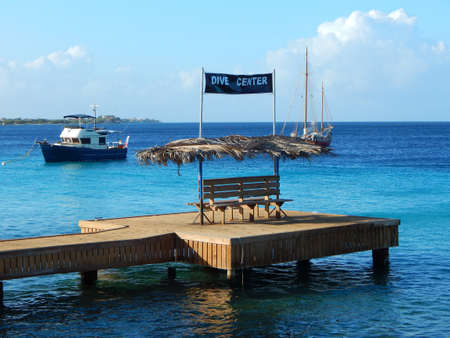 Dive center in the Caribbean with boats in the backの写真素材