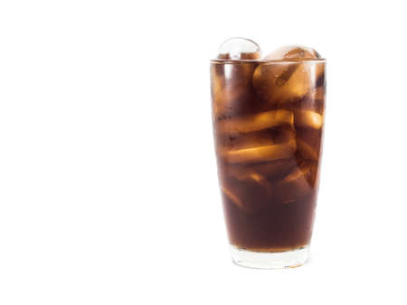 full soft drink is cool and ice cubes  in glass on white backgroundの写真素材