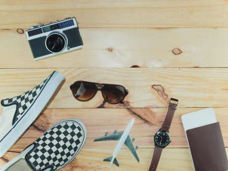 Top view of Travel Accessories Costumes, The cost of travel vacation item prepared for the plan trip on wooden, Concept Traveling, Copy space background.の写真素材