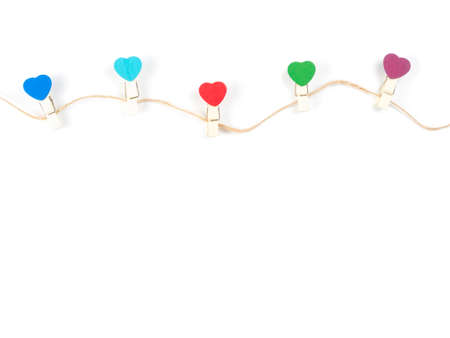 Top View Wooden colorful Paper Clip Heart set with rope wooden isolate on white background. Concept...