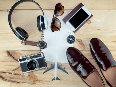 Top view of Travel Accessories Costumes, The cost of travel vacation item prepared for the plan trip on wooden, Concept Traveling, Copy space background.の写真素材