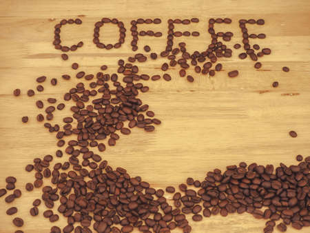 coffee bean  on slat wood and write coffeeの写真素材