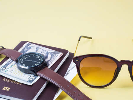 Concept go travel holiday, Vacations plan Boarding pass and passport, bank note, watch, sunglass and...