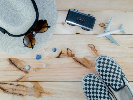 Top view of Travel Accessories Costumes, The cost of travel vacation item prepared for the plan trip on wooden, Concept Traveling, Copy space background.の写真素材