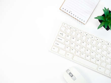 Modern white office desk table with keyboard computer and other office supplies of necessity, Top...