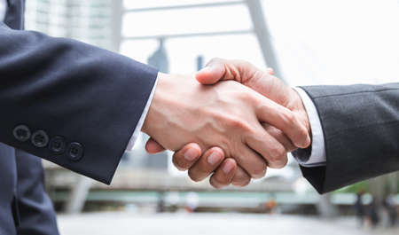 Closeup Shaking hands deal success good job. Meeting, negotiation, greeting or welcome to business...