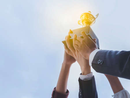 The best team helped each other reach their goals target to success. The hand of a business man and...