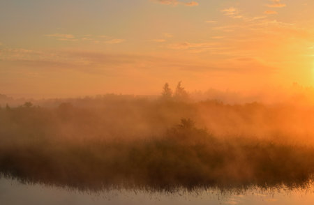 Sunrise over the misty river in the morning. Beautiful landscape.の写真素材