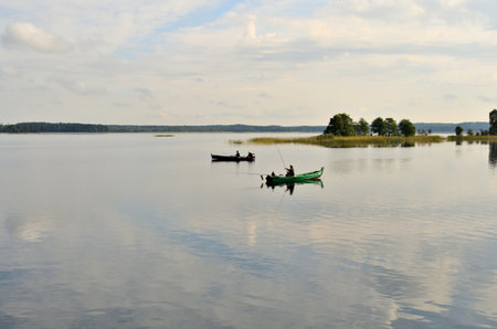 Fishing boat on the lake in the summer, Russia, Uralの写真素材