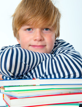 smiling boy with books 