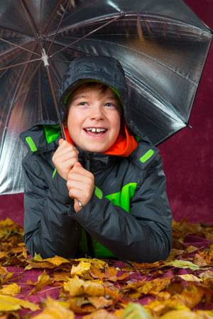 happy boy with umbrellaの写真素材