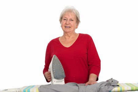 female senior with flat ironの写真素材
