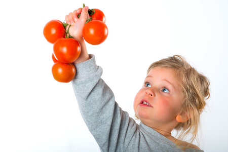 child keeping up tomatoの写真素材