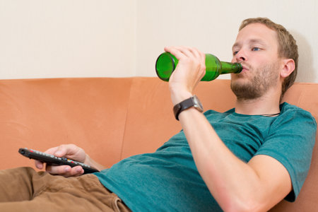 young man is relaxing at home