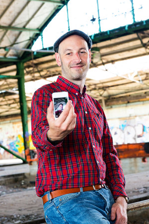 man taking a selfie with the smartphone