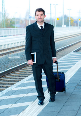 man in suit on business tripの写真素材