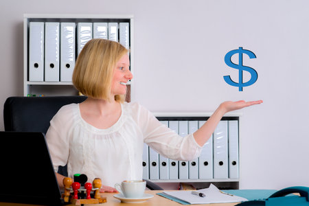 young business woman with dollar sign in the officeの写真素材