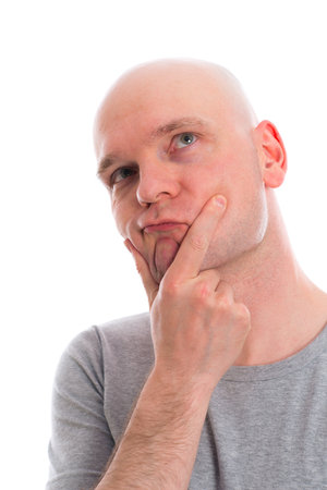 funny young man with bald head  is refectingの写真素材