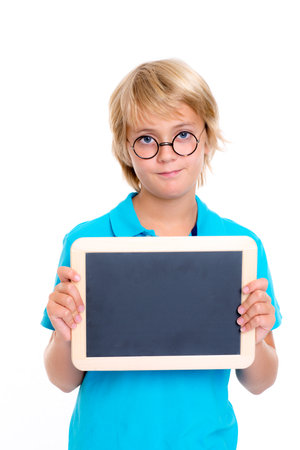 boy with round glasses and little blackboard in front of white backgroundの写真素材