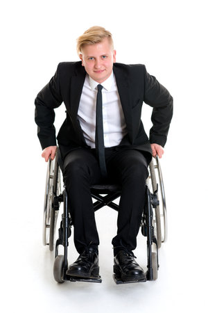 portrait of a young businessman in a wheelchairの写真素材