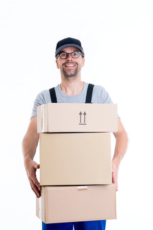 friendly postman with parcels in front of white backgroundの写真素材