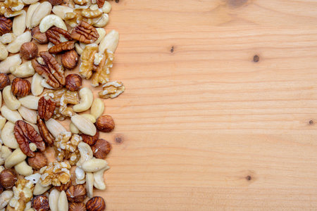 different nuts on wooden ground from aboveの写真素材