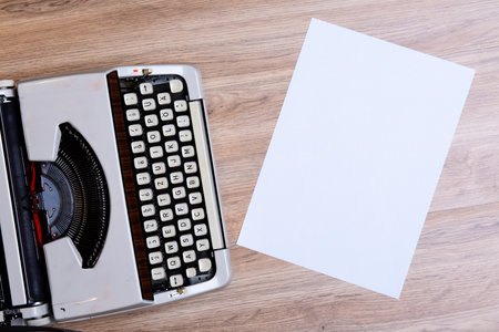old typewriter on wooden ground from aboveの写真素材