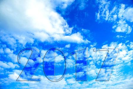 new year- 2017 in front of blue cloudy skyの写真素材