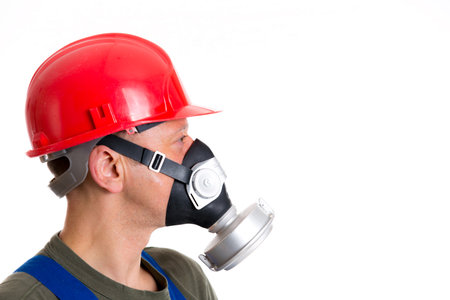 young workman with red hard top and protecting maskの写真素材