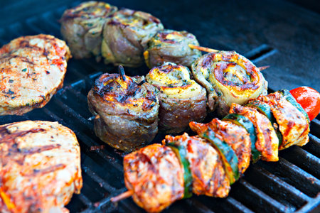 different meat and sausage on gas barbecueの写真素材