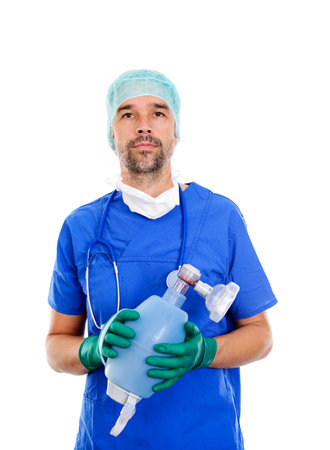 Young anesthetist with resuscitation bag  in front of white backgroundの写真素材