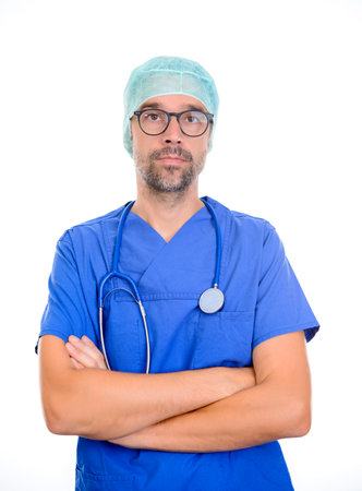 young doctor in front of white background looking in to the cameraの写真素材